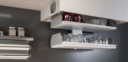 A lift provides convenient access to the contents of the wall unit