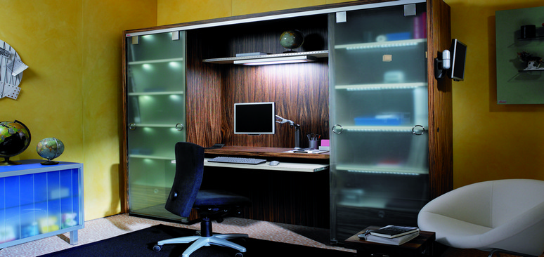 The work room is concealed in the wall unit