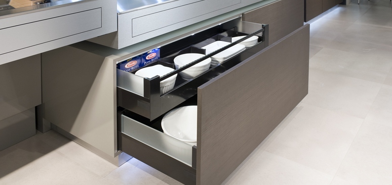 The kitchen drawers, which are over a metre wide, can be moved out of the base unit with a mere finger press.